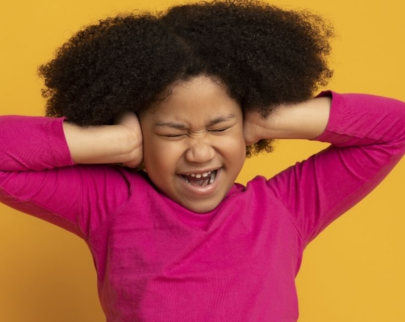 Children haircut in London Picture of a girl with sensory overload, getting a haircut